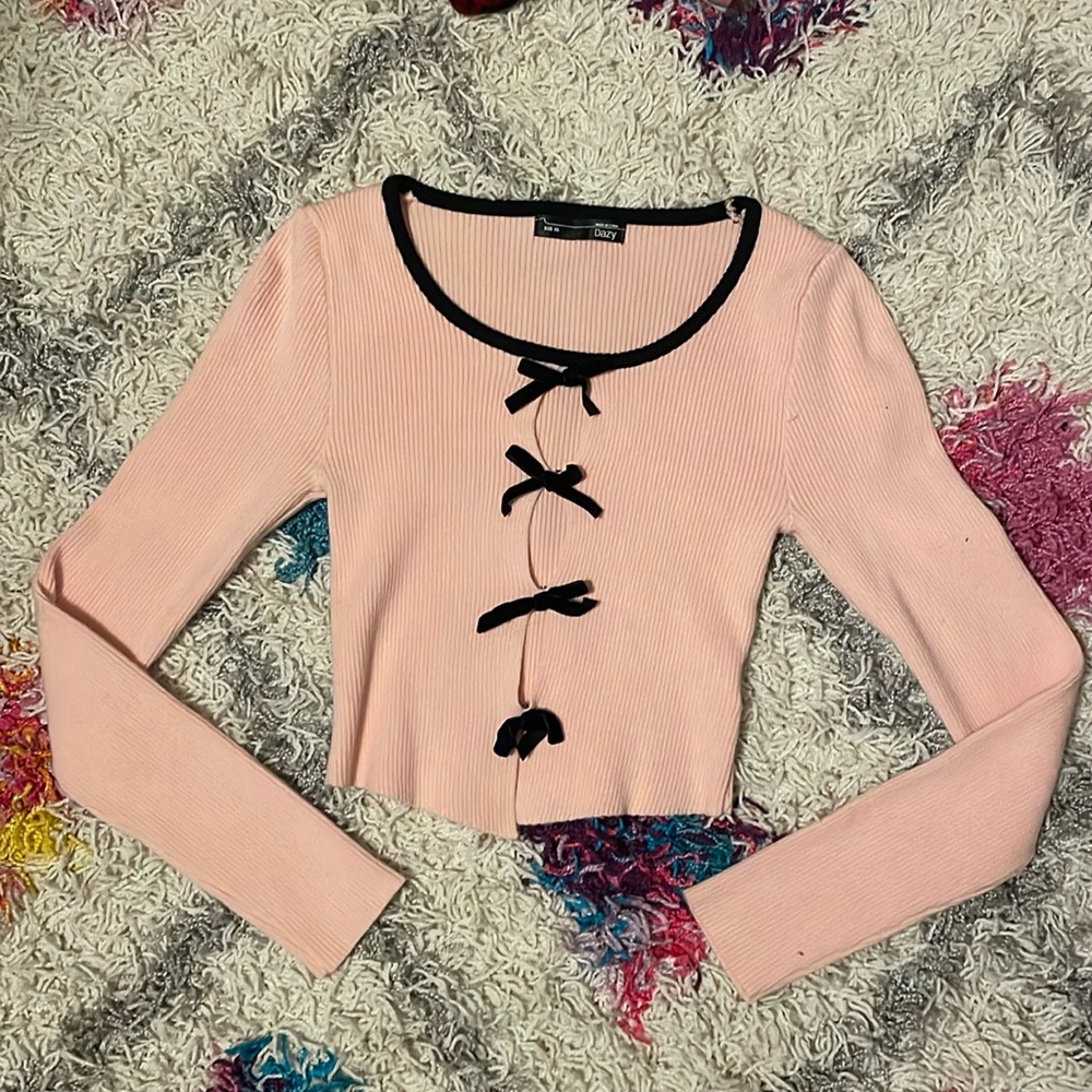 Pink cropped long-sleeve top with cutouts
